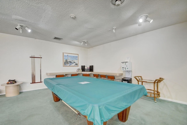 recreation room with carpet, a textured ceiling, and billiards