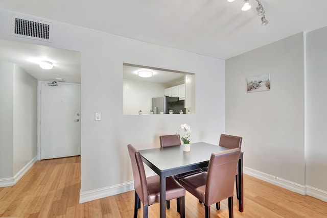 dining space featuring light hardwood / wood-style flooring