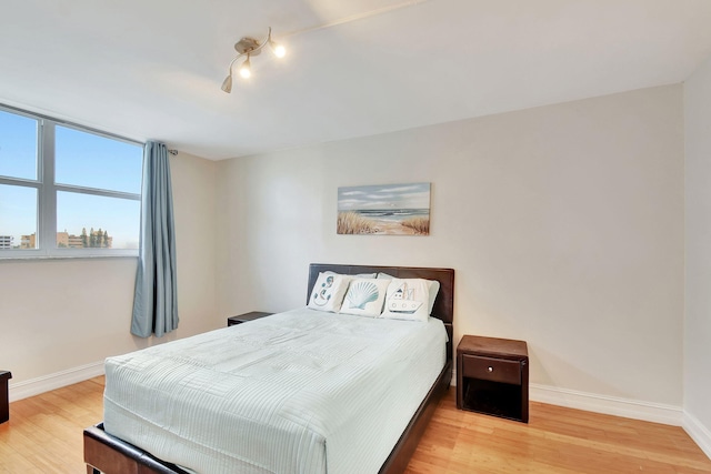 bedroom featuring wood-type flooring