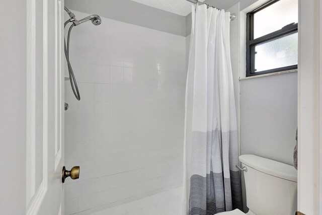 bedroom featuring ensuite bath, ceiling fan, sink, a closet, and light wood-type flooring