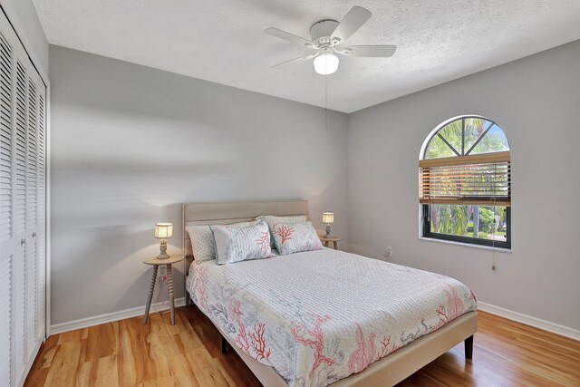 bedroom featuring ceiling fan and light hardwood / wood-style floors