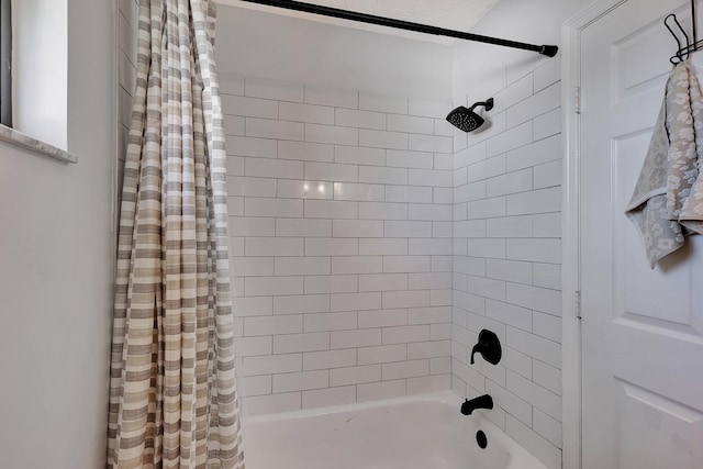 bathroom featuring shower / bath combo with shower curtain