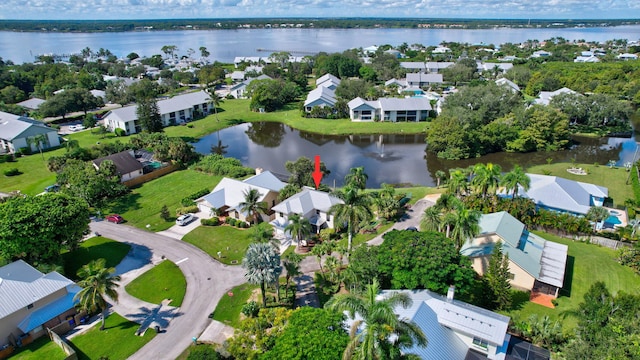 birds eye view of property featuring a water view