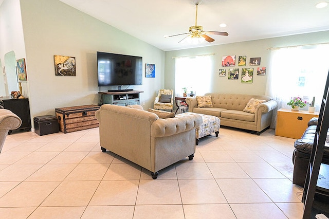 living room with light tile patterned flooring, ceiling fan, and vaulted ceiling