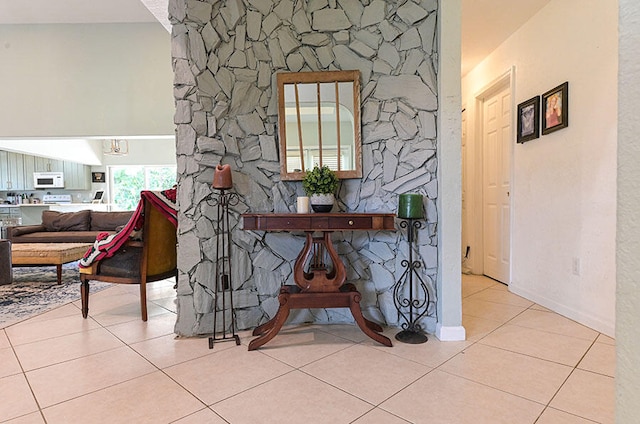 hall with light tile patterned floors