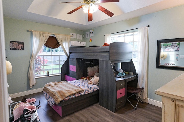 bedroom with ceiling fan and dark wood-type flooring