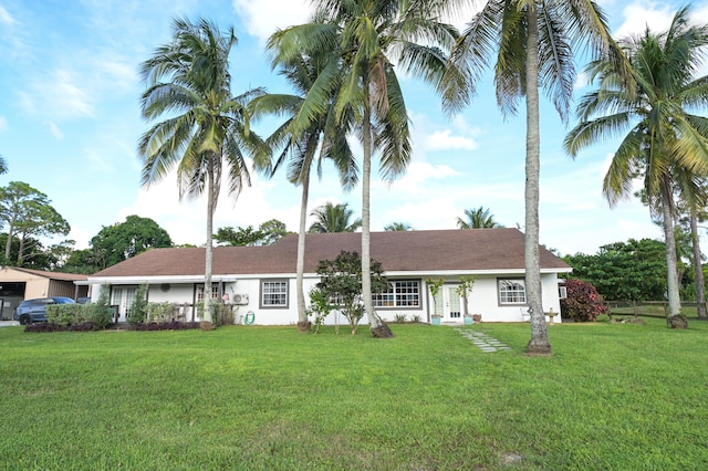 single story home with a front yard