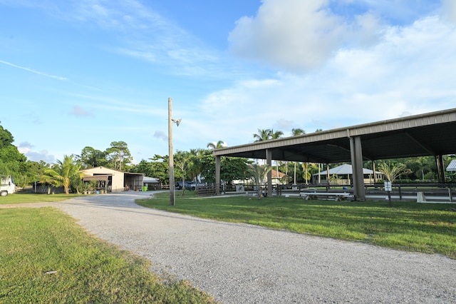 view of property's community with a lawn