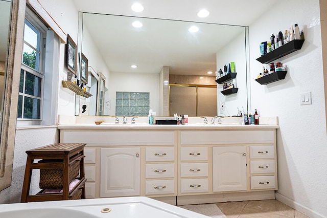 bathroom featuring tile patterned floors, vanity, and independent shower and bath