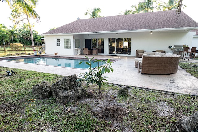 view of swimming pool with outdoor lounge area and a patio area