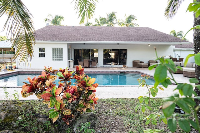 view of swimming pool featuring outdoor lounge area and a patio