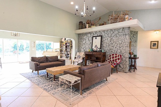 tiled living room with a notable chandelier and high vaulted ceiling