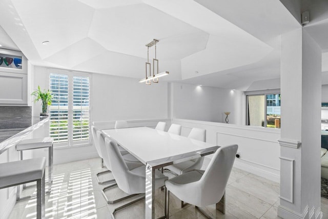 dining area with vaulted ceiling