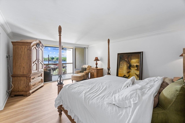 bedroom with light hardwood / wood-style floors, crown molding, and access to exterior