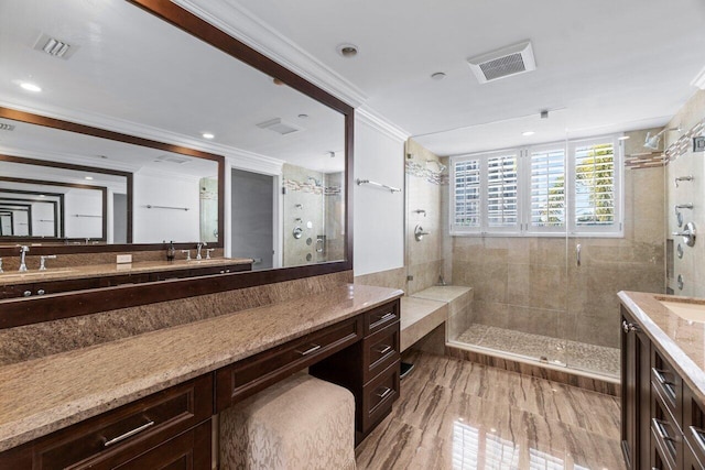 bathroom with vanity, crown molding, hardwood / wood-style flooring, and tiled shower