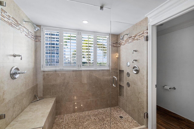 bathroom with walk in shower and hardwood / wood-style flooring