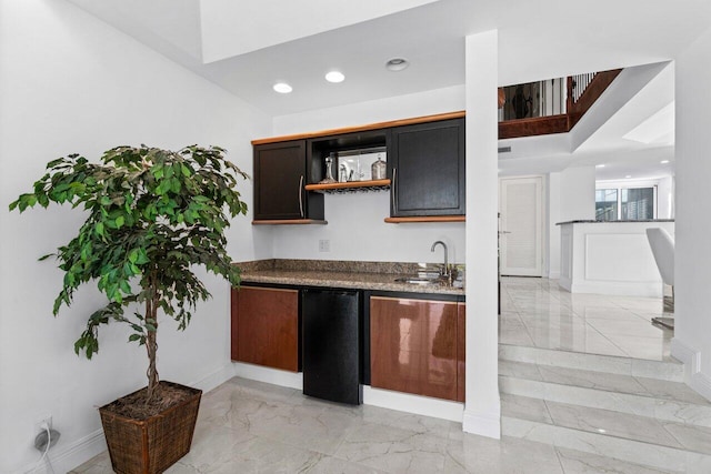 kitchen with sink and black fridge