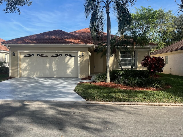 ranch-style house featuring stucco siding, a garage, concrete driveway, and a tiled roof