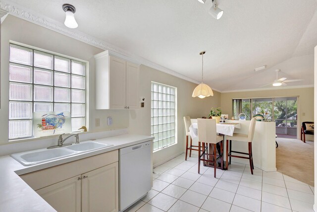 dining space featuring light colored carpet, a textured ceiling, and ornamental molding