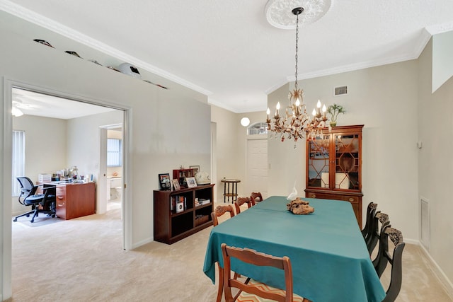 carpeted dining area featuring an inviting chandelier and ornamental molding