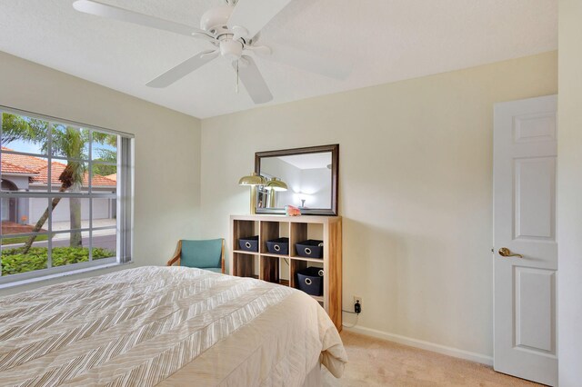 carpeted office with ceiling fan