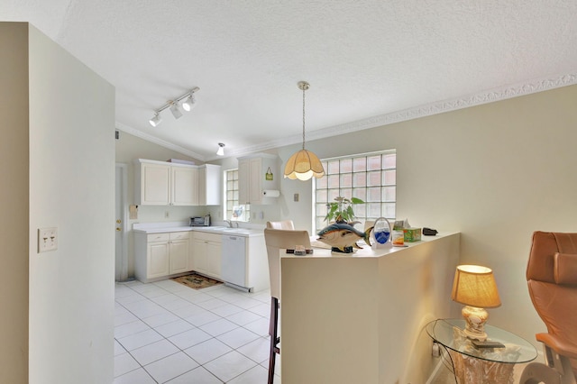 kitchen featuring dishwasher, vaulted ceiling, light tile patterned floors, a textured ceiling, and white cabinetry