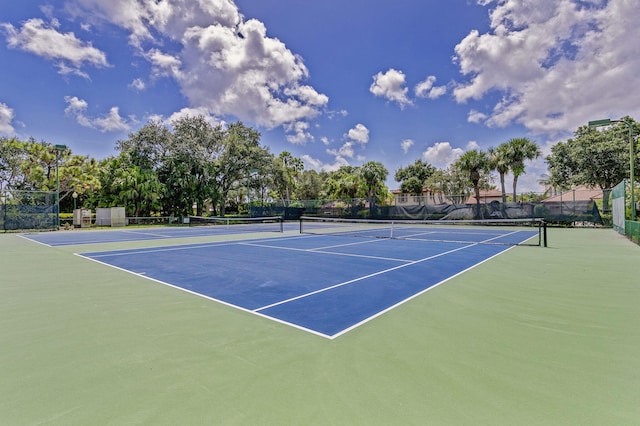 view of sport court with basketball hoop