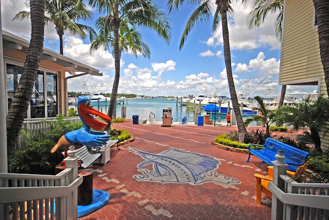 view of patio / terrace featuring a dock and a water view