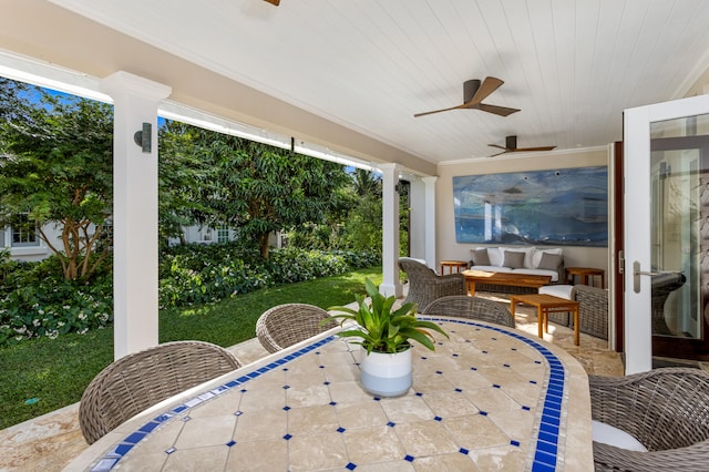 view of patio / terrace featuring an outdoor living space and ceiling fan