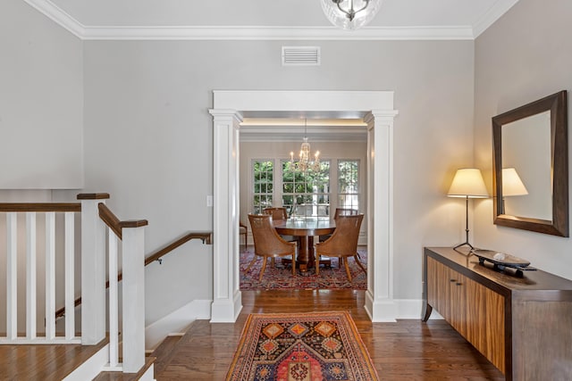 interior space with crown molding, dark hardwood / wood-style floors, and a notable chandelier