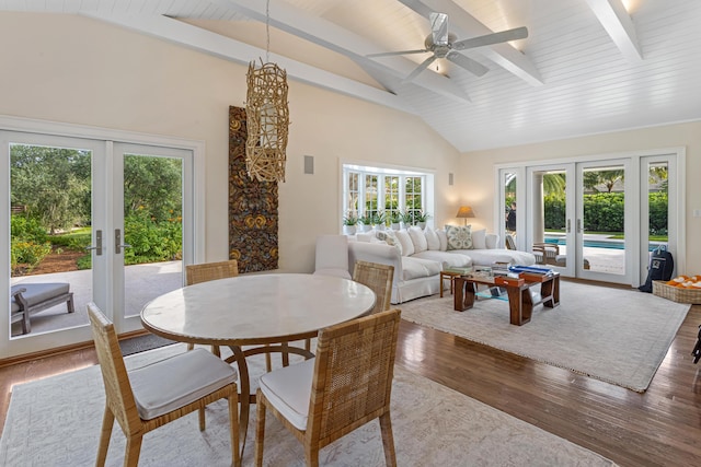 dining space featuring french doors, ceiling fan, hardwood / wood-style flooring, high vaulted ceiling, and beamed ceiling