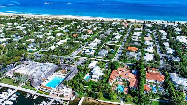 bird's eye view featuring a water view and a view of the beach