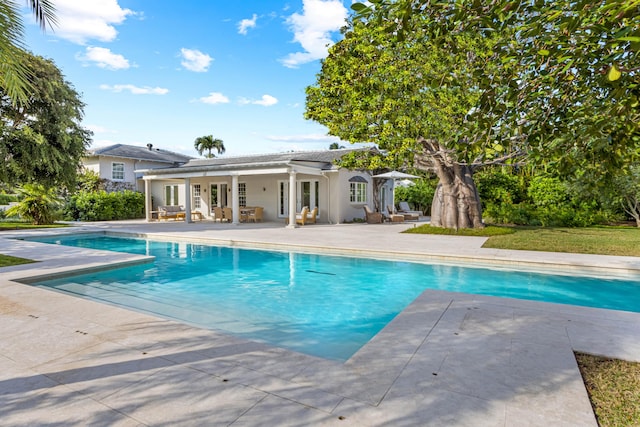 view of pool featuring a patio