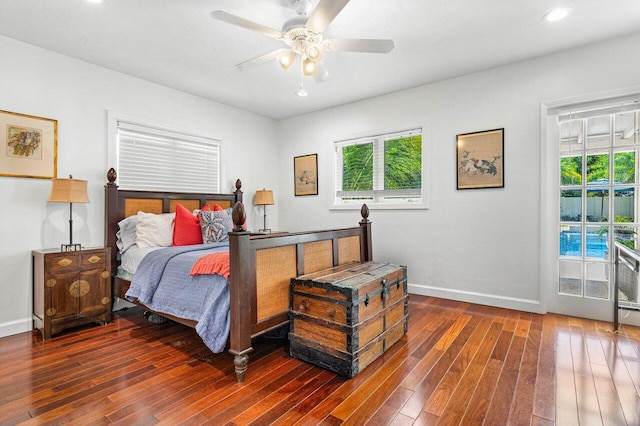 bedroom featuring ceiling fan and dark wood-type flooring