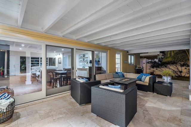 view of patio / terrace featuring an outdoor living space with a fire pit