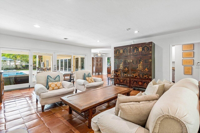 living room featuring tile patterned flooring and ceiling fan