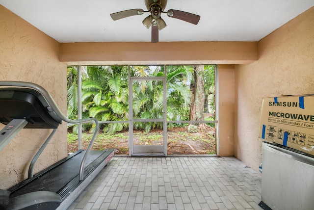 workout area with ceiling fan