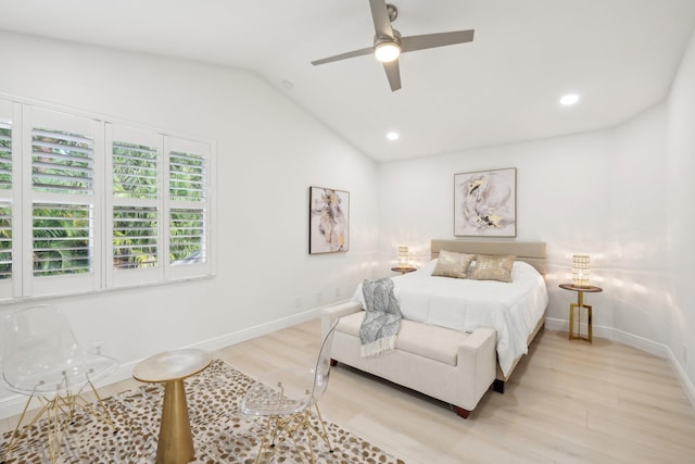 bedroom with light wood-type flooring, lofted ceiling, and ceiling fan