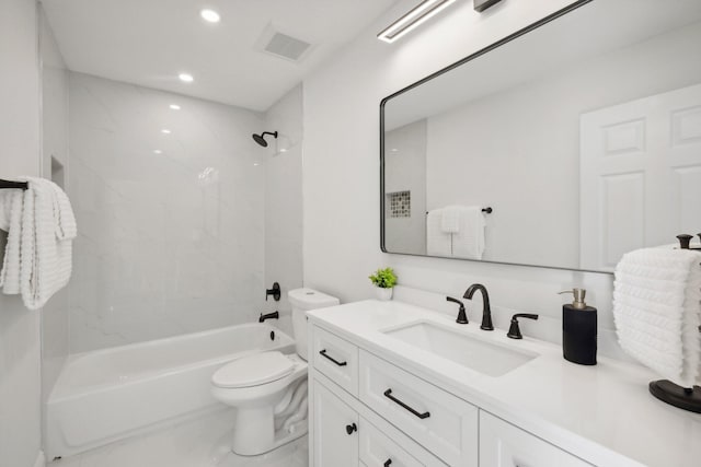 full bathroom with vanity, toilet, and tiled shower / bath