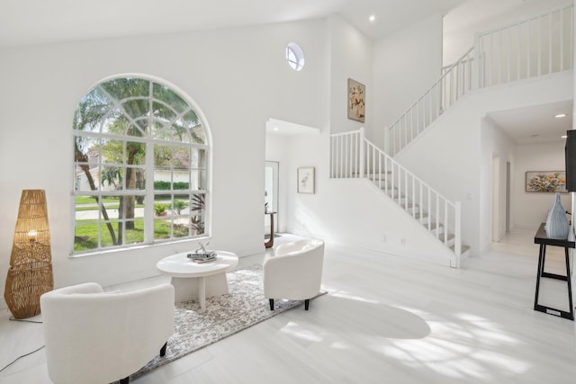 foyer with high vaulted ceiling