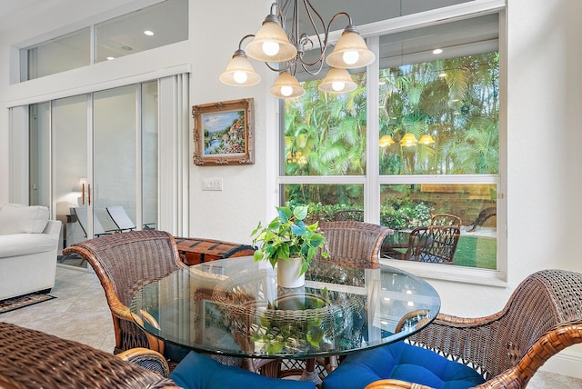 dining space with an inviting chandelier