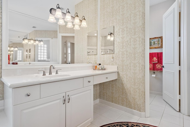 bathroom with tile patterned flooring and vanity