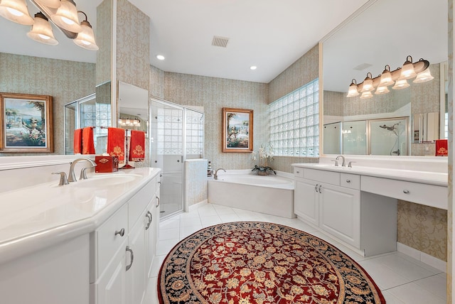 bathroom featuring plus walk in shower, tile patterned flooring, and vanity