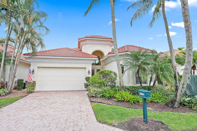 mediterranean / spanish-style house featuring a garage