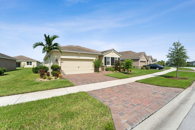 single story home featuring a garage and a front yard