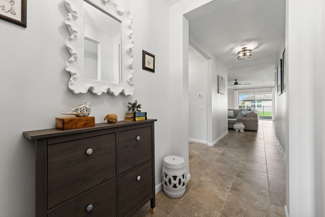 hallway featuring a textured ceiling