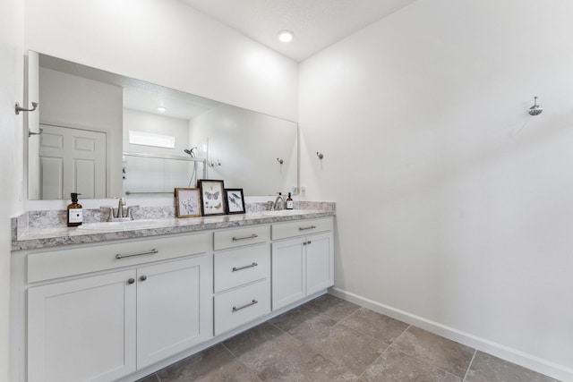 bathroom featuring vanity and an enclosed shower