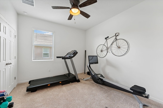 workout area with light carpet and ceiling fan