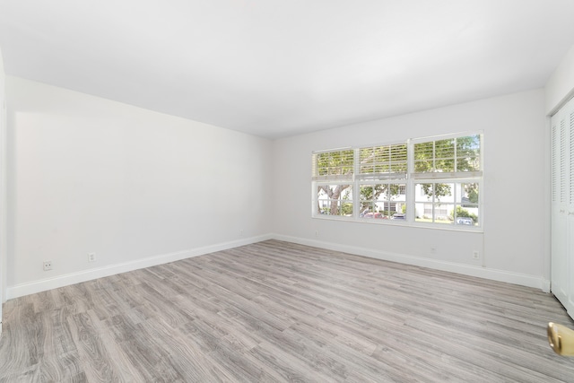 spare room featuring light hardwood / wood-style floors