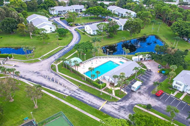 birds eye view of property with a water view